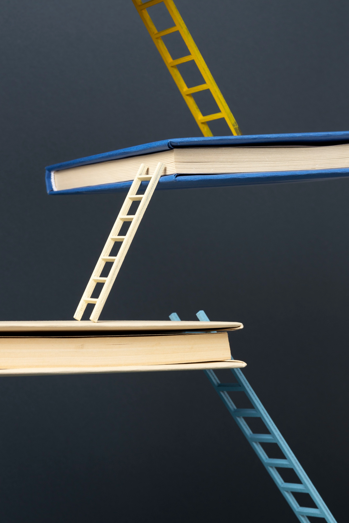 a stack of books with ladders on top