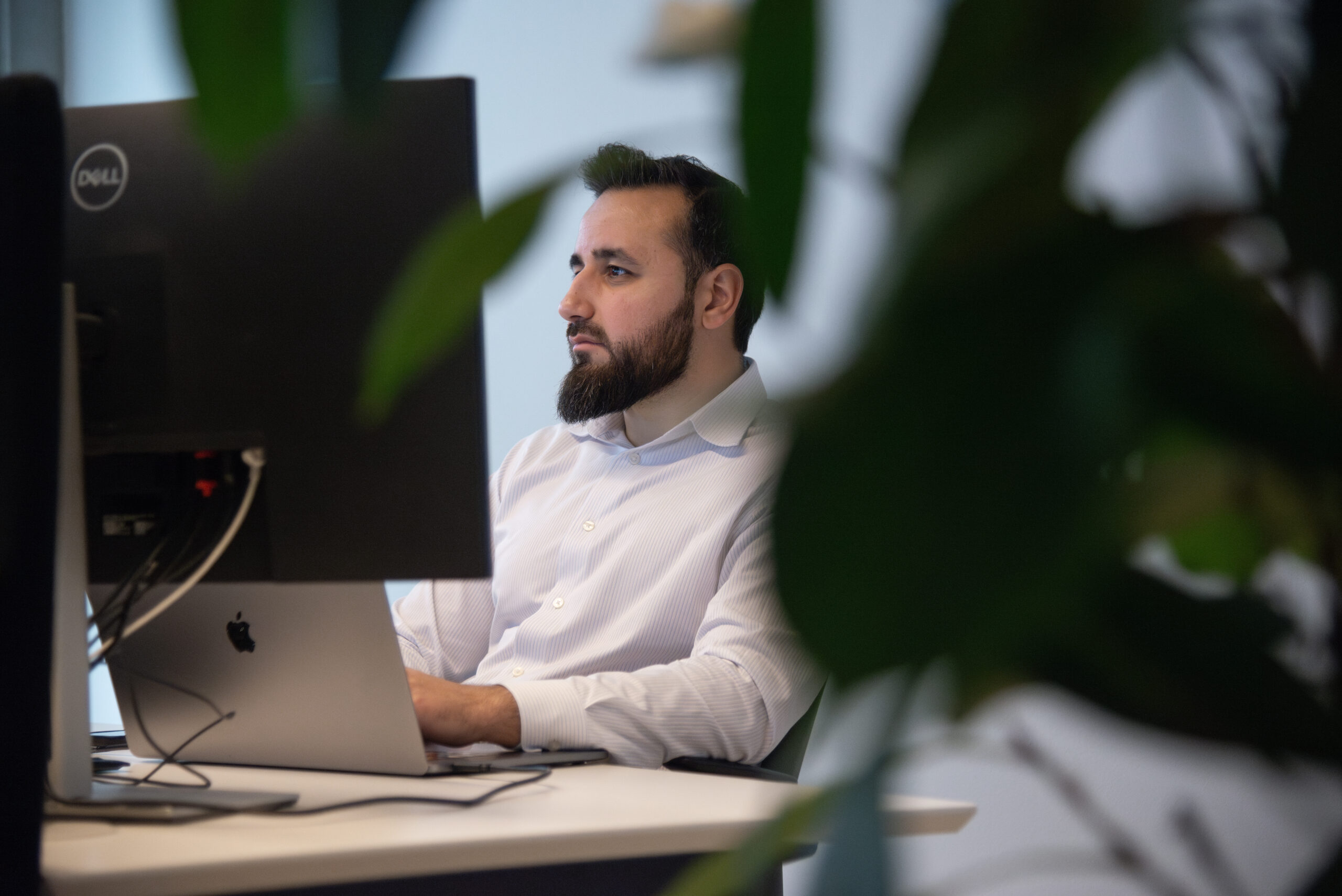 a man sitting at a desk with a computer